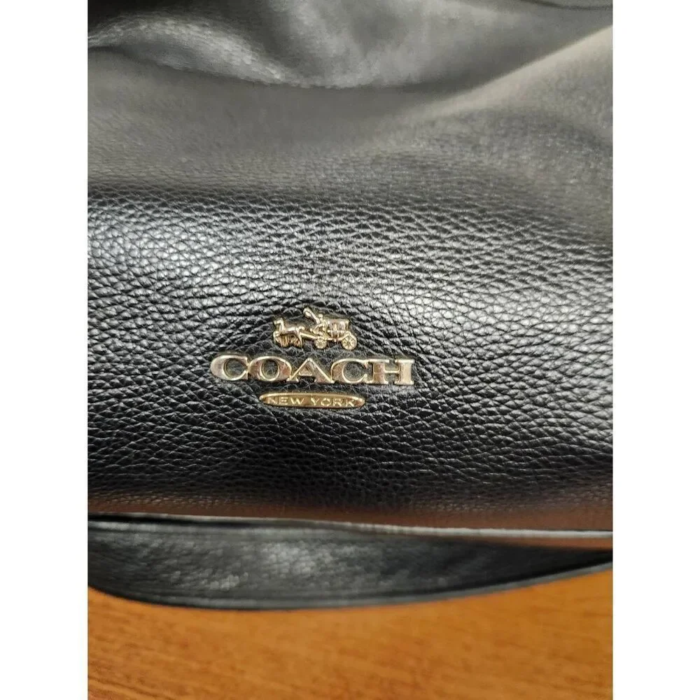 Coach Dufflette Pebble Leather Crossbody Bag Black 35775. See pictures for condi